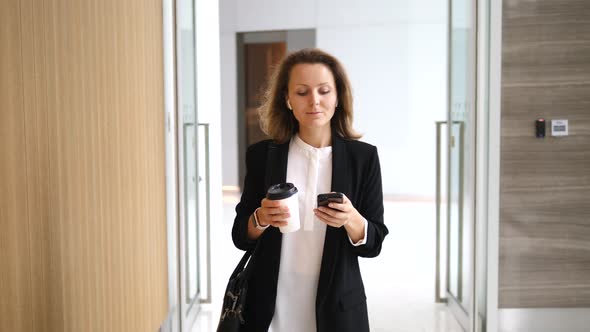 Business, Technology And People - Businesswoman With Coffee Using Smartphone