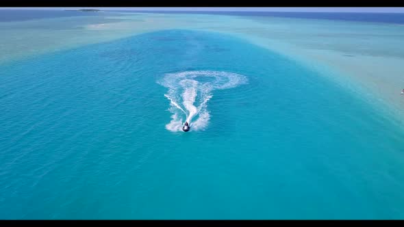 Aerial above panorama of marine resort beach break by blue sea and white sandy background of adventu