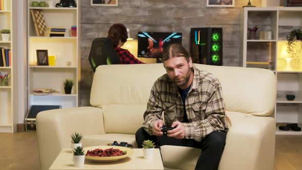 Excited Man Jumping in the Air After His Victory While Playing Video Games