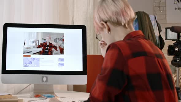 Teenage Blogger Watching Video of Herself