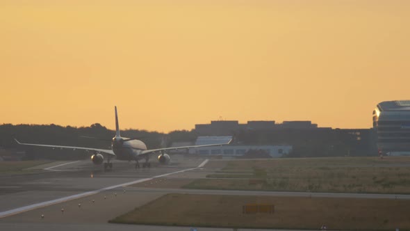 Airplane Landing at the Early Morning