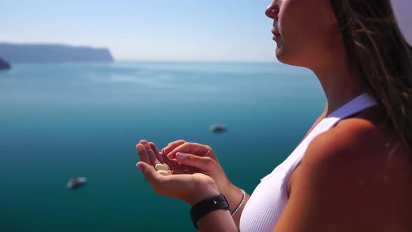 Woman Eating Milky Almond Nuts