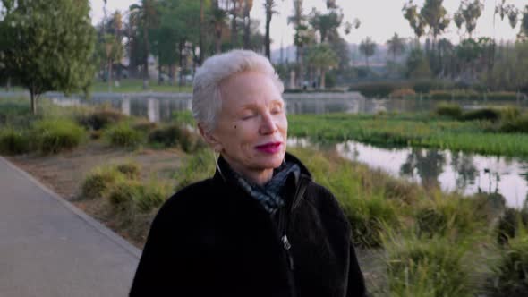 Senior Woman Working Out In The Park