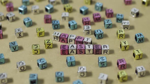 Happy Easter Greeting Card, Colorful Letters. Yellow Background. Focus on Cubes