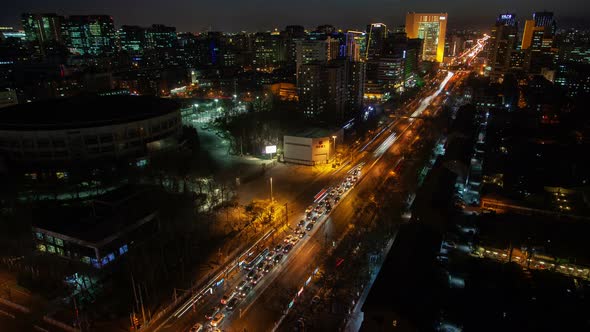 Chinese Buildings Surround Wide Beijing Highway Timelapse