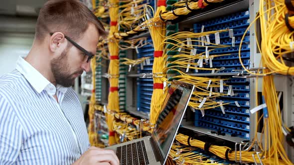 Engineer Working in Data Room