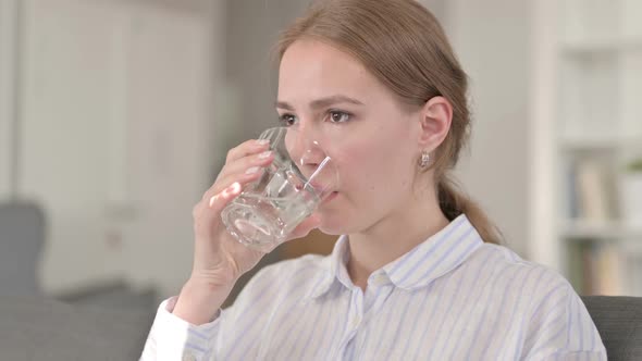 Portrait of Relaxing Young Woman Drinking Water