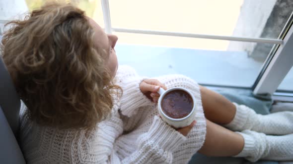 Winter Autumn Cold Season Concept, Girl In Knitted Clothes With Cup By Window