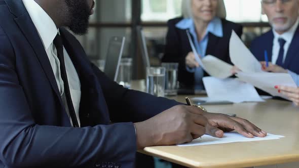 Black Male Employee Tired of Noisy Colleagues, Suffering Migraine, Overwork