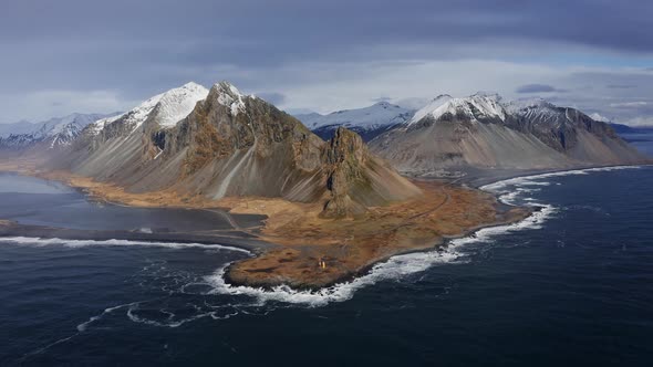 Drone Pulling Back From Eystrahorn Mountain In Landscape