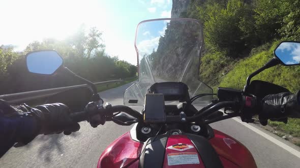 POV Biker Rides a Motorcycle on a Scenic Sunny Mountain Road Austria