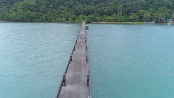 Epic aerial shot over a bridge in the picturesque country of Thailand