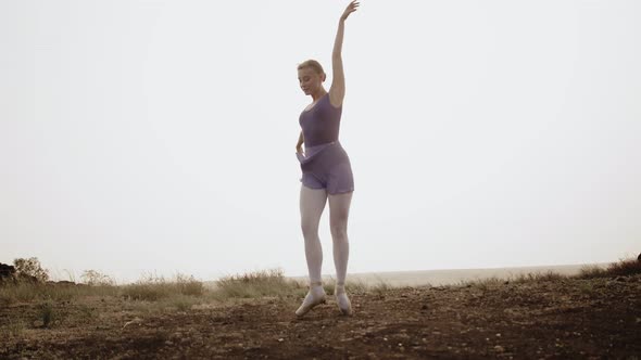 Beautiful Ballerina Dances on Pointe Shoes Outdoor