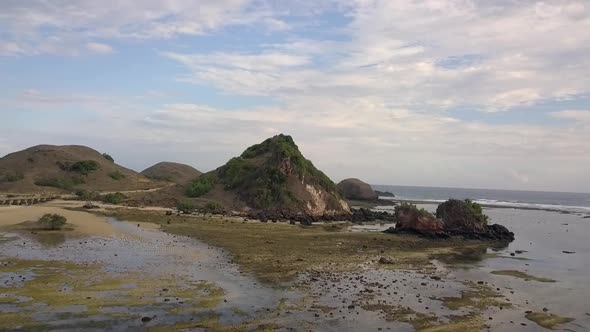 Pantai Seger Low tide in nature reserve.Daring aerial view flight fly backwards drone footage of Ma