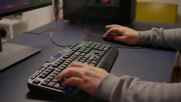 Closeup of Player Hands Using RGB Keyboard