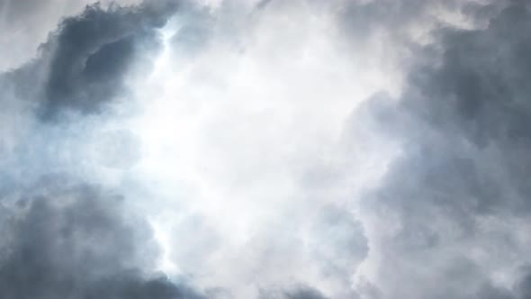 4k dark, gray cumulonimbus cloud filled with a thunderstorm