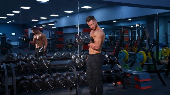 Motivated man training muscles