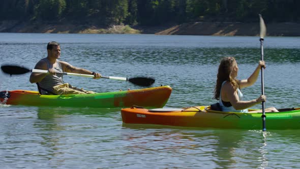 Couple kayaking in lake