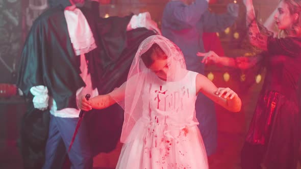Young Girl in Scary Dead Bride Costume at a Halloween Party