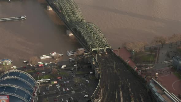 AERIAL: View Over Cologne Hohenzollern Bridge and Cathedral in Beautiful Hazy Sunlight 