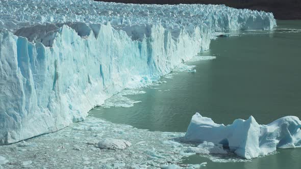 Medium shot of the front of Perito Moreno Glacier and lake Argentino