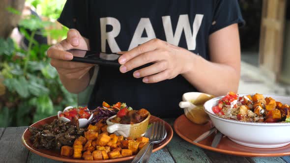 Food Photography. Hands Taking Pictures Of Healthy Vegan Food Using Smartphone.