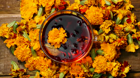 Antioxidant Close Up Natural Tea From Marigold Flowers Top View, Tea For Colds. Naturotherapy Drink.