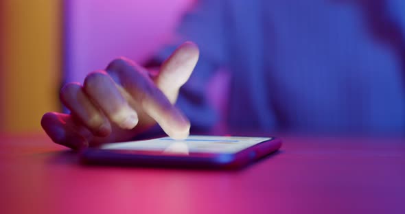 Woman use of cellphone at night