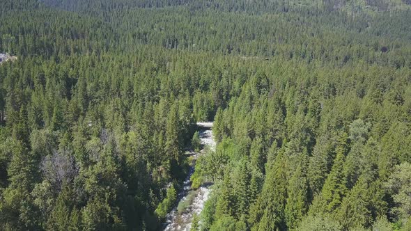 Aerial Drone Revealing Beautiful Water Rapids And Mountains In The Background 1