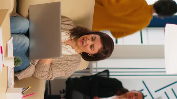 Manager Woman Sitting on Couch Holding Laptop and Talking on Video Call