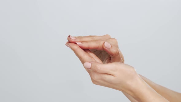 Beautiful female hands studio close-up. Arms of young woman.