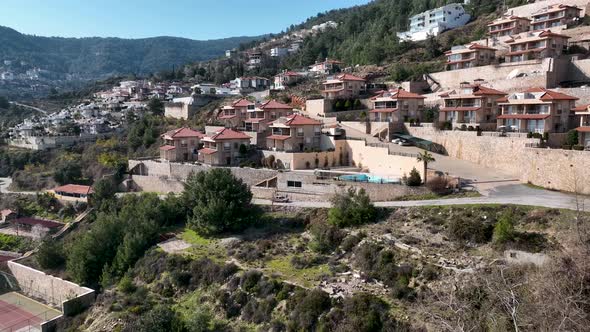 Complex of villas in the mountains aerial view 4 K