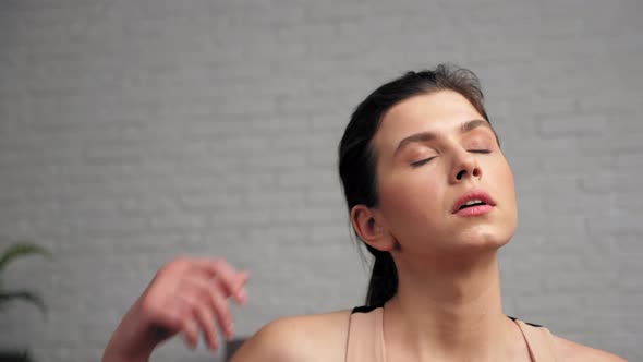 Sportive Strong Woman Wiping Sweat From Face After Intense Workout Exercise