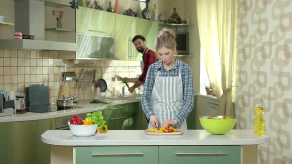 Couple Cutting Vegetable