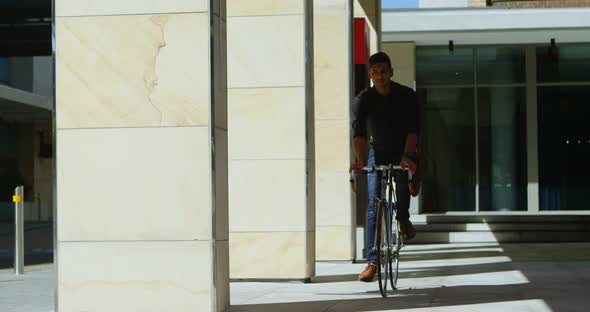 Man checking time on smartwatch while riding bicycle 4k