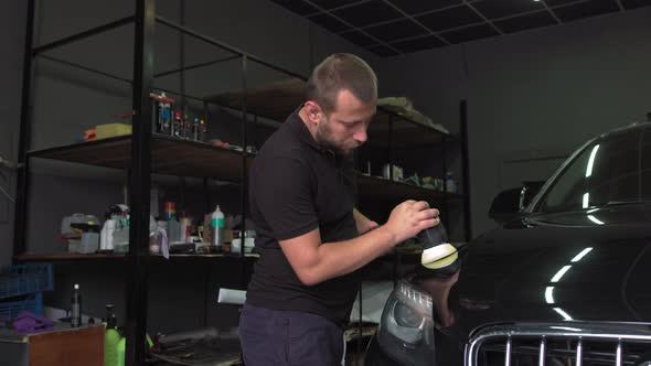 Worker Polish a Car with Auto Polisher