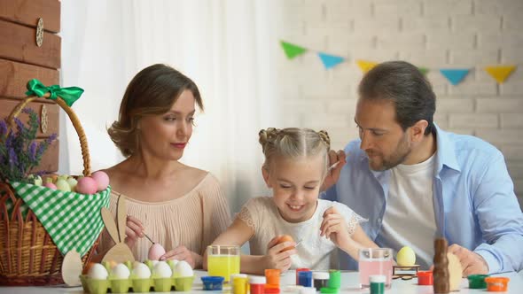 Father Tickling Ear of Cute Daughter With Paintbrush, Comfortable Family Evening