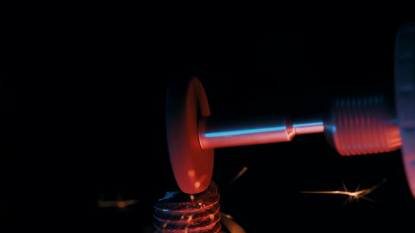 Close-up of Worker Grinds Down Metal with a Grinder at Construction Plant. Industrial Production