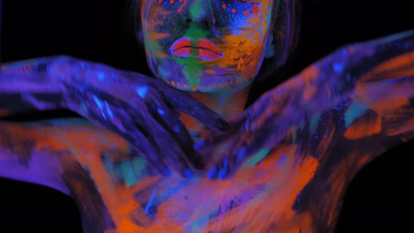 Portrait of a Graceful Model Girl with a UV Pattern on Her Face and Body