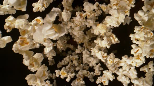 Super Slow Motion Shot of Fresh Fluffy Popcorn Flying Towards the Camera at 1000Fps