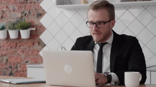 Businessman Serious Salesman Working From Home Using Laptop Pc Computer To Negotiate with Colleague