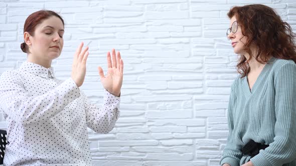 The Psychotherapist Conducts a Hypnosis Session