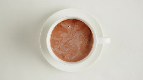 Black Tea with Milk in Cup Top View