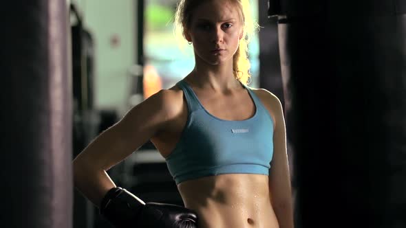 Portrait of a woman before doing Muay Thai kickboxing training at the gym