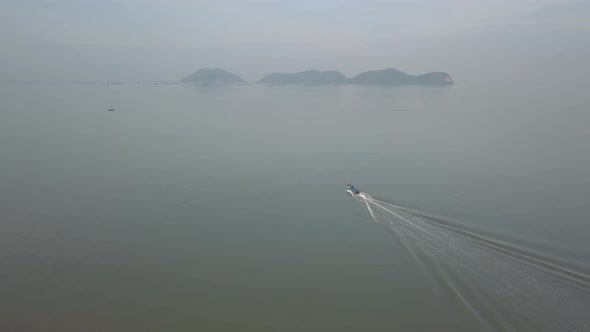 A boat move toward Pulau Aman island