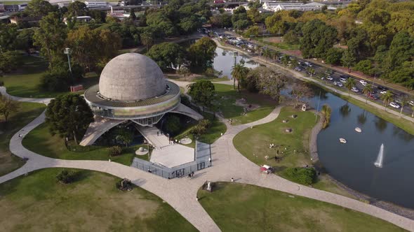 drone flight flying over the planetario park in buenos aires in orbit with the building showing the