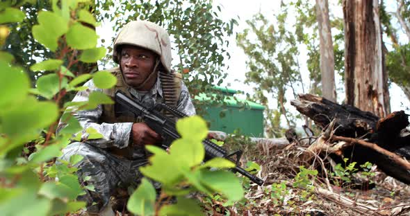 Military soldier guarding with a rifle