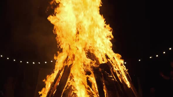 Big Bonfire Burning at Night. Slow Motion. The Big Fire Background.