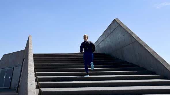 Attractive Young Woman, Running Up Stairs, Stock Footage By Brian Holm Nielsen