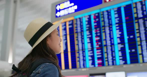 Woman use of mobile phone inside airport